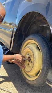 Cabiz staff fitting a doughnut spare tire